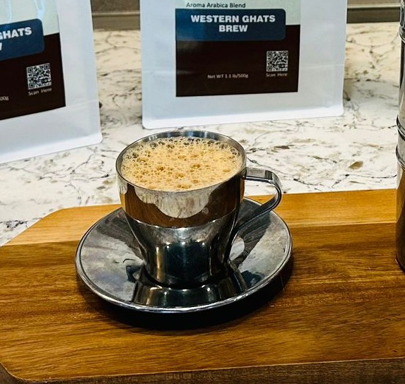 South Indian filter coffee served in a traditional tumbler and davara